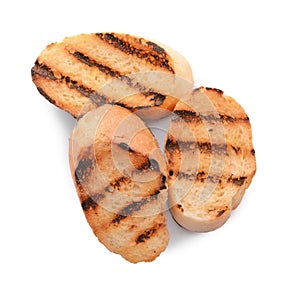 Burnt toasted bread on white background, top view