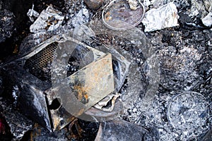 Burnt trash. Remains of burnt garbage. Household waste