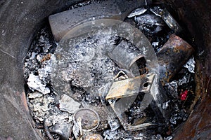 Burnt trash. Remains of burnt garbage. Household waste