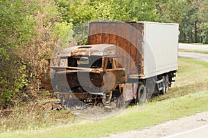 Burnt truck on the side of the road