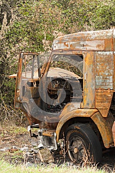 Burnt truck on the side of the road