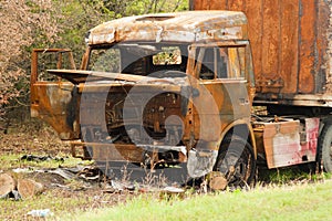 Burnt truck on the side of the road