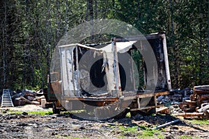 Burnt and Vandalised Truck in a field.