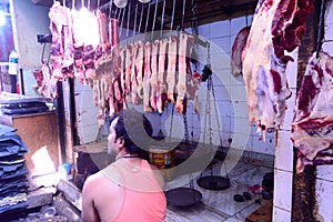 Burrabazar, Kolkata, India MAY, 2017: A seller is selling fresh raw red meat. Butcher shop for display. Burrabazar Bara Bazaar