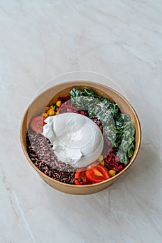 Burrata Cheese with Healthy Black Rice Protein Salad, Turmeric Chickpea, Kale, Cherry Tomatoes / Forbidden rice or Oryza Sativa