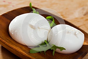 Burrata cheese and rukkola leaf closeup