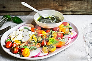 Burrata with colorful Cherry Tomatoes Salad with Pesto