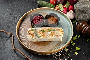 Burrito with vegetables. Shawarma. A hot appetizer of chicken