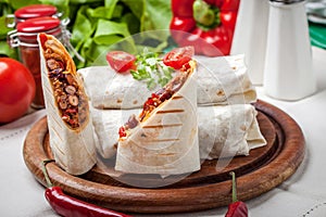 Burritos filled wiht minced meat, bean and vegetables.