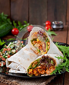 Burritos wraps with minced beef and vegetables