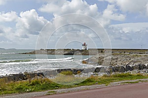 Burry Port Harbour entrance and Breakwater with small Old stone Lighthouse. photo