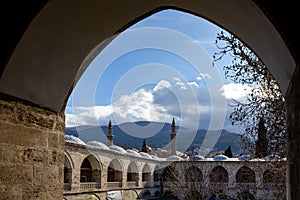 Bursa historic old  `Ulu Mosque` minarets `Pirinc Caravanserai` inn and Uludag Mountain view