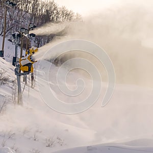 Burst of artificial snow from snow cannons in Utah