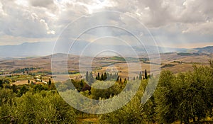 A burst of sunshine over the rolling hills of Tuscany