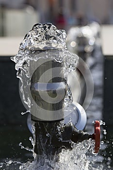 Burst water pipe close up