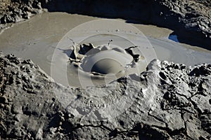 Bursting mud bubble of mud volcano