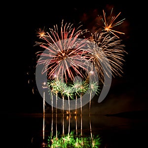 Bursts of Red, Orange and Green Fireworks