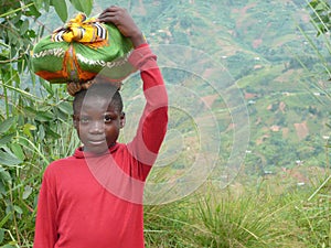 Burundi Boy with Sack on Head