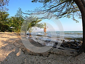 Burundi Bujumbura lake Tanganyika, windy cloudy sky and sand beach