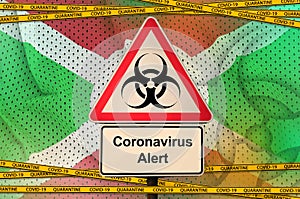 Burundi flag and Covid-19 biohazard symbol with quarantine orange tape. Coronavirus or 2019-nCov virus concept