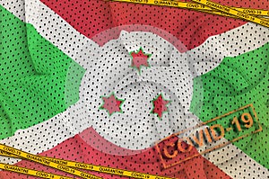 Burundi flag and Covid-19 biohazard symbol with quarantine orange tape and stamp. Coronavirus or 2019-nCov virus concept