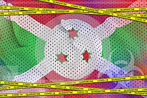 Burundi flag and Covid-19 quarantine yellow tape. Coronavirus or 2019-nCov virus concept