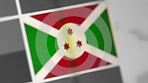 Burundi national flag of country. Burundi flag on the display, a digital moire effect.