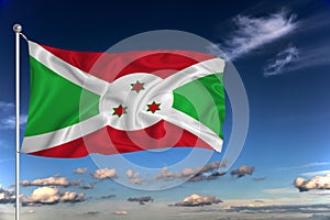 Burundi national flag waving in the wind against deep blue sky.  International relations concept