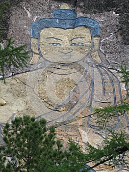 Buryatia. 30-meter image of Buddha carved on a rock.