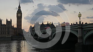 Bus crosses Westminster Bridge at sunset