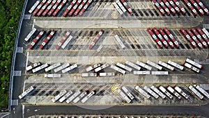 Bus depot red buses top-down view aerial drone shot