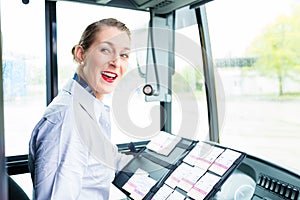 Bus driver woman selling tickets