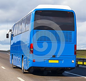 Bus Goes on Fsphalted Country Highway