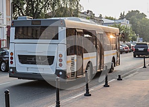 Bus moves along the city street