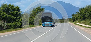 Bus moves along a suburban highway