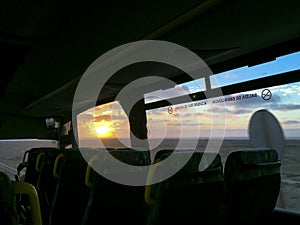 Bus ride in the sunset with ocean view.