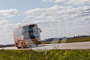 Bus on the road with motion blur. Blurred image background. Colo