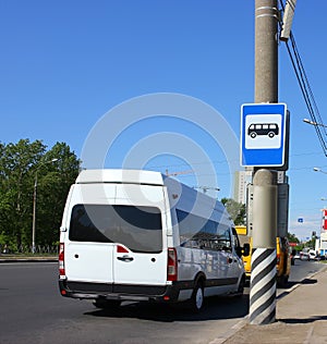 Bus roadsign & x28;bus stop& x29; near asphalt road
