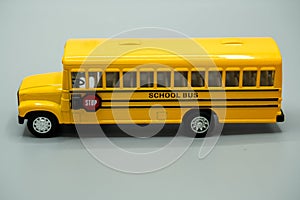 bus. school bus. yellow school bus for little kids to ride and go to school. on gray background.