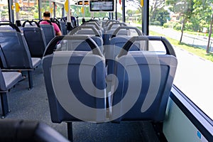 Bus seats on empty double decker bus. Blank advertising space; for mockup display; bus seat sticker wrap