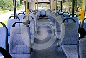 Bus seats on empty double decker bus. Blank advertising space; for mockup display; bus seat sticker wrap