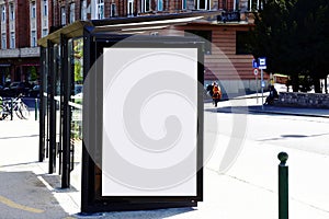 Bus shelter at a bus stop. empty white ad panel and billboard sign for mockup