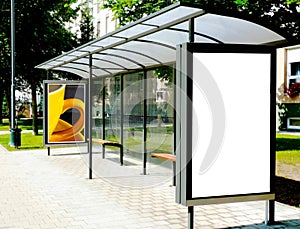 bus shelter with template ad panels in glass lightbox for mockup at city transit busstop