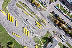 Bus station with parked yellow busses. city public transportation. aerial view