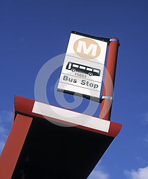 Bus stop against blue sky