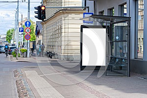 Bus stop with an empty poster mockup, template of an advertising banner on the stop of transport