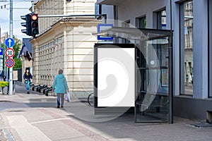 Bus stop with an empty poster mockup, template of an advertising banner on the stop of transport