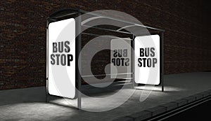 Bus stop with glowing billboard at night