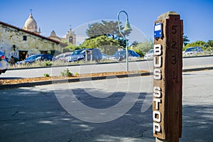 Bus stop on Junipero Serra; Carmel Mission in the background, Carmel-by-the-Sea, Monterey Peninsula, California