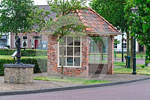 Bus stop and old water pump